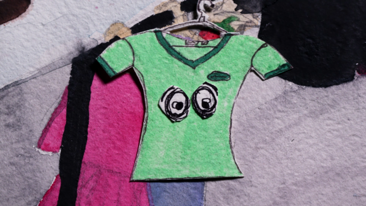 Vihreä piirretty paita, jolla on silmät